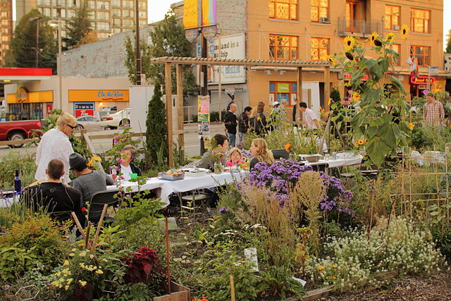 Dining in the Davie Community Garden, Vancouver, BC, Canada (2010) by Geoff Peters via Wikimedia Commons https://commons.wikimedia.org/wiki/File:2010_Davie_Street_community_garden_Vancouver_BC_Canada_5045979145.jpg