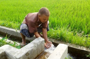 Farmer Drinking Water from Deep Pump, Bangladesh (2017).