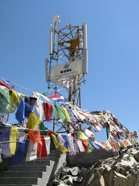 A mobile phone|mobile phone tower in Leh, Ladakh, India, surrounded by Buddhist prayer flags (2009).