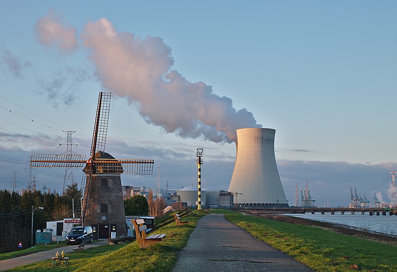 De Molen (windmill) and the nuclear power plant cooling tower in Doel, Belgium.