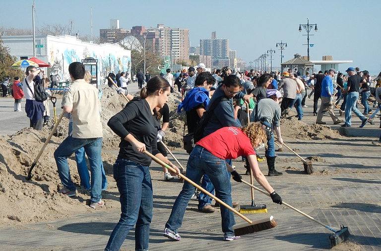 Volunteers cleaning boardwalk after Hurricane Sandy