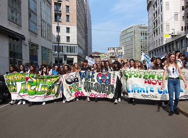 Students holding banners, School strikes for climate - Fridays For Future in Milan, Italy