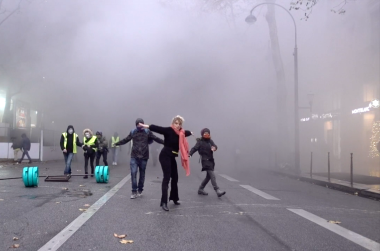Woman dancing in French protests