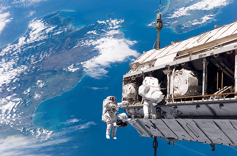 NASA astronaut Robert L. Curbeam, Jr. (left) and European Space Agency astronaut Christer Fuglesang, both STS-116 mission specialists, participate in the mission's first of three planned sessions of extravehicular activity (EVA) as construction resumes on the International Space Station.