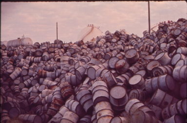 A mountain of damaged oil barrels
