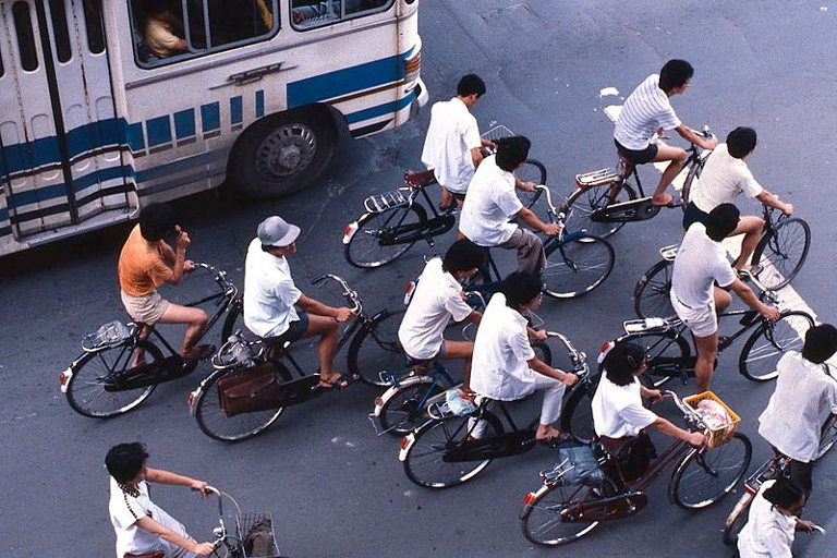 Bicyclists in a Chinese city wait at a stoplight, 1987