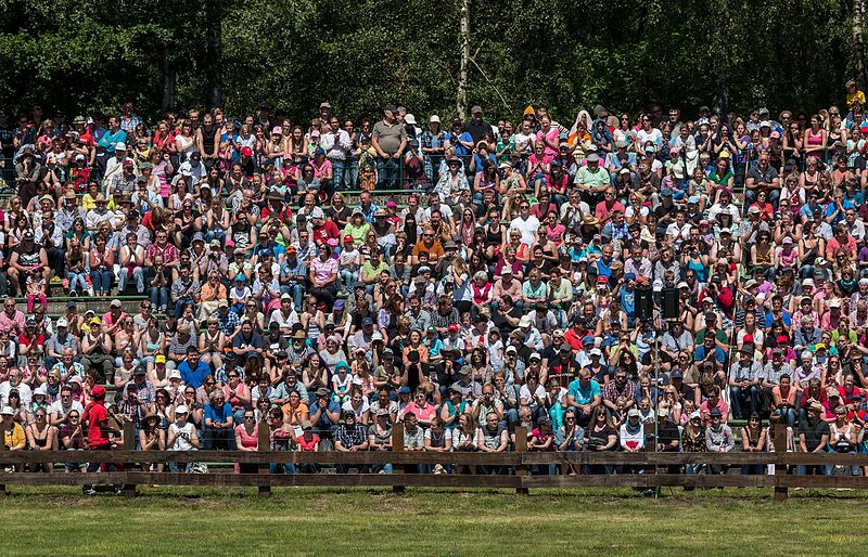 Crowd watching a sports event. Audience, Merfelder Bruch, Dülmen, North Rhine-Westphalia, Germany; Wildpferdefang 2014