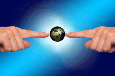 Hands pointing to Earth