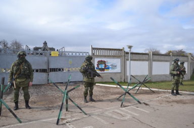 Russian soldiers blocking Ukrainian air base