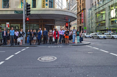 Pedestrians waiting for lights to change