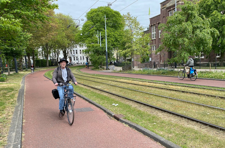 Rick Steves biking through Amsterdam