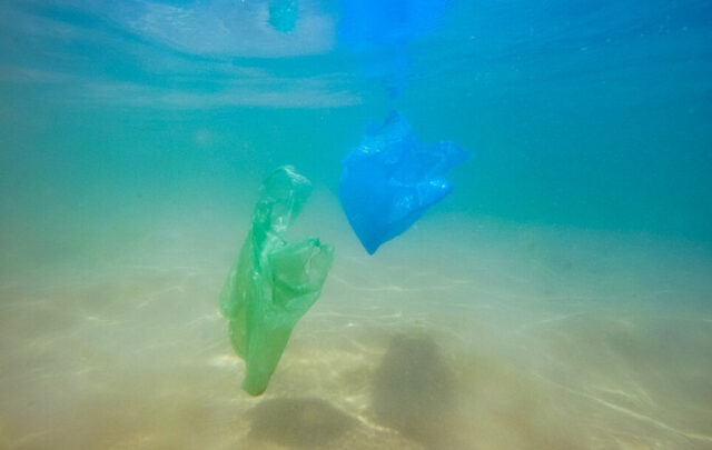 Plastic waste drifting down to the ocean floor.