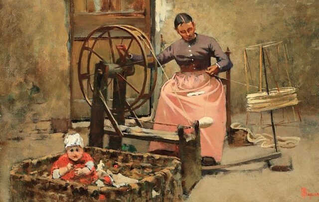 Woman at a spinning wheel.