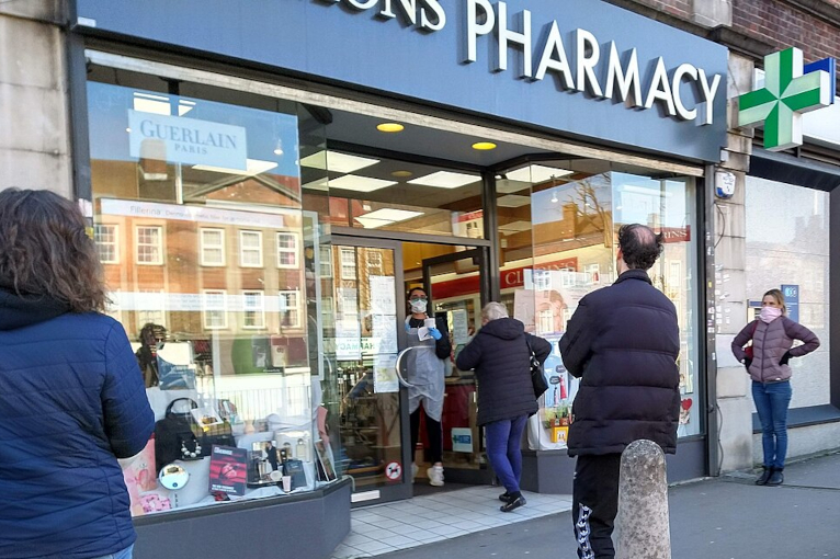 Social distancing at UK pharmacy in March 2020