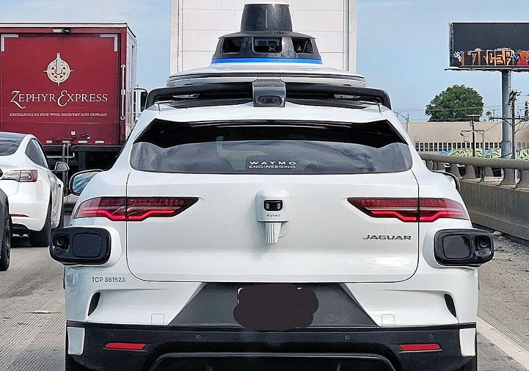 Waymo car on a freeway