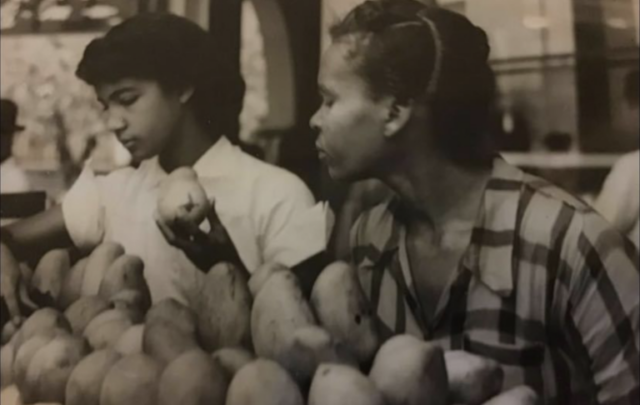 Author's mother selling fruit in a market