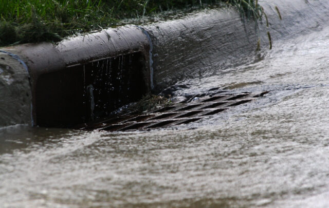 rainwater runoff into a storm drain