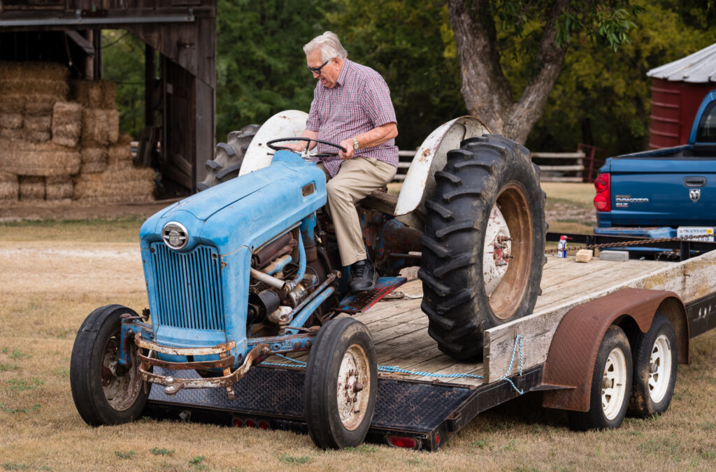 Wes Jackson drives a blue tractor.