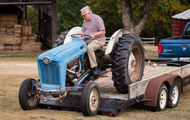 Wes Jackson drives a blue tractor.