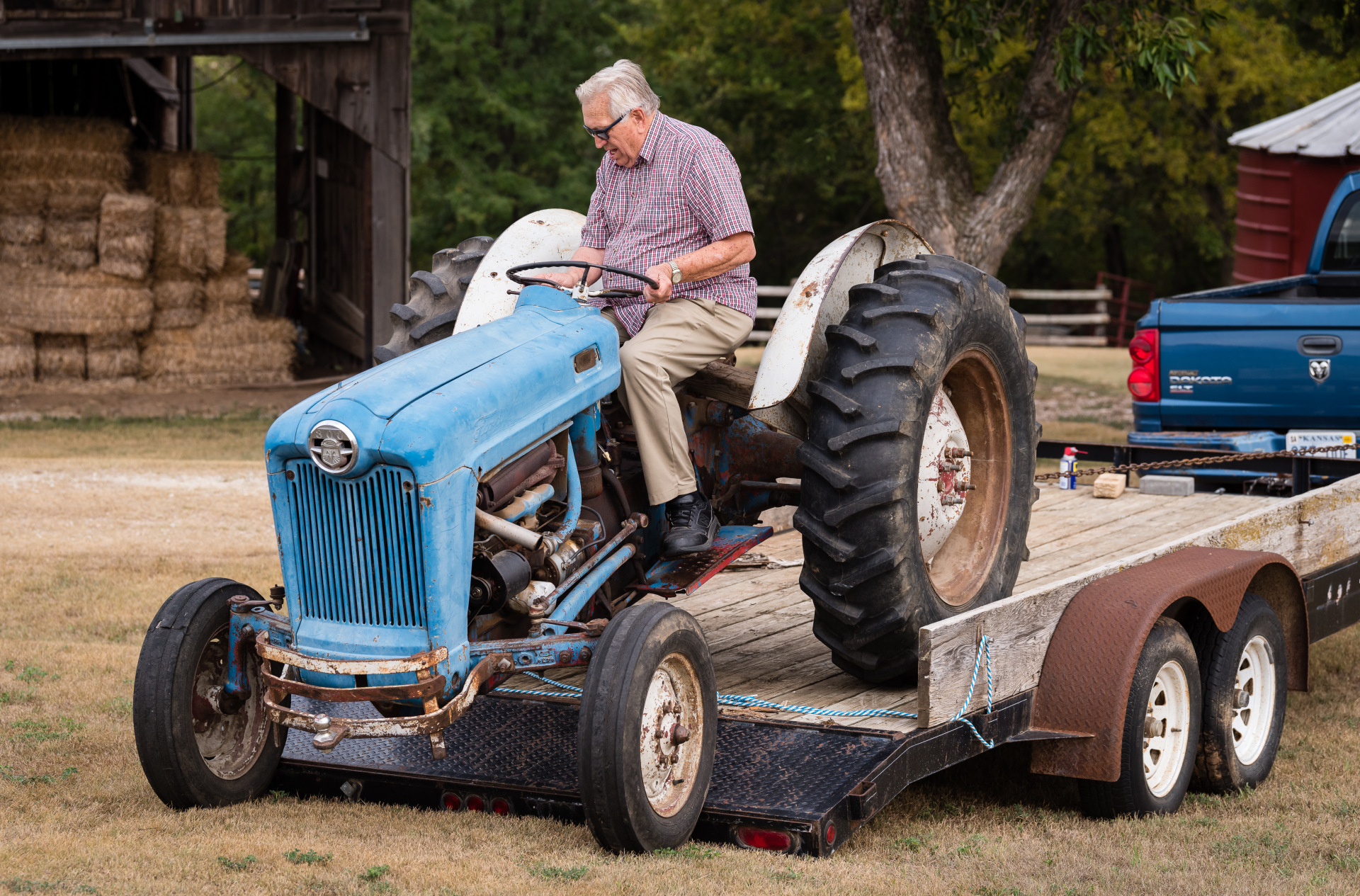 Wes Jackson drives a blue tractor.